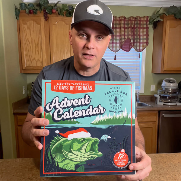 Angler holding a Fishmas catch 3