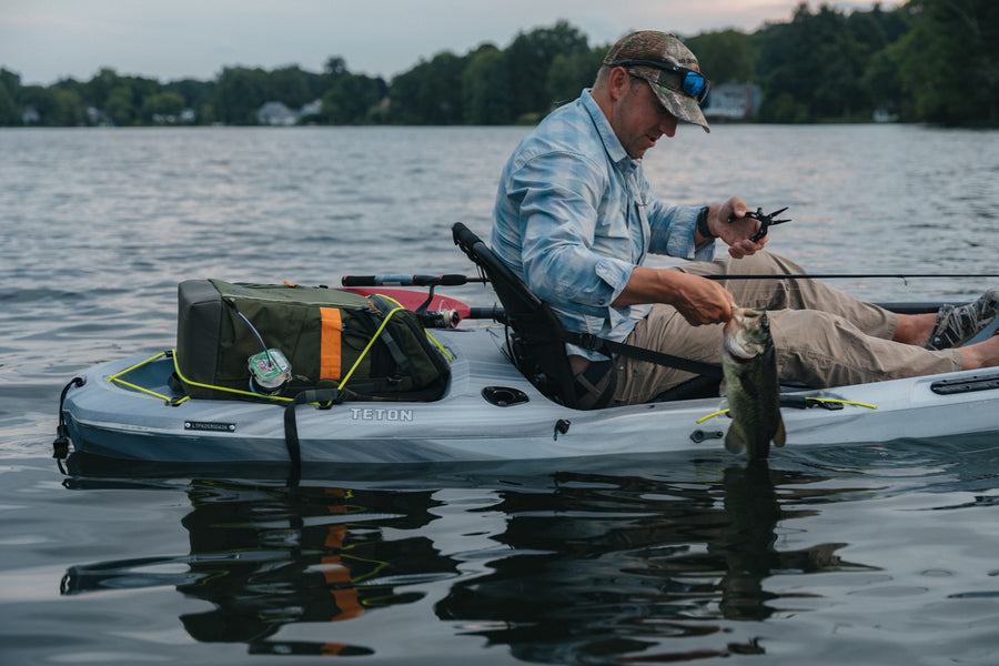 AnglerPack strapped to a kayak bow
