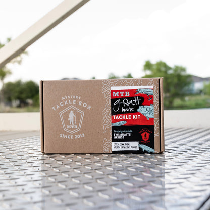 Tackle kit box on a metal surface with blurred outdoor background
