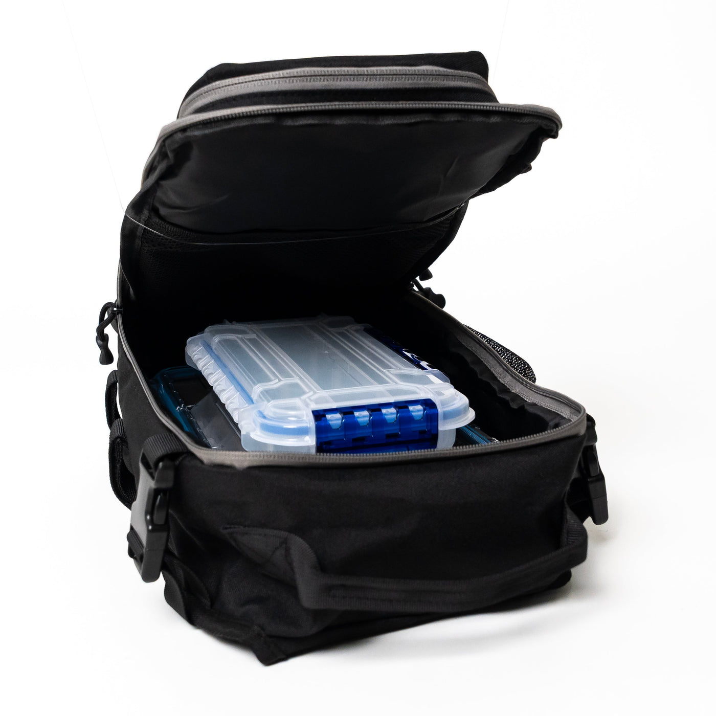 A black soft-sided gear bag shown open on a white background, with a translucent blue and clear hard case stored inside.