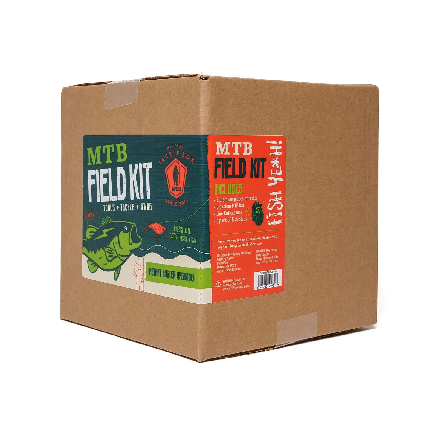 Cardboard box with 'MTB Field Kit' labels on a white background