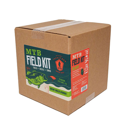 Cardboard box with 'MTB Field Kit' labels on a white background