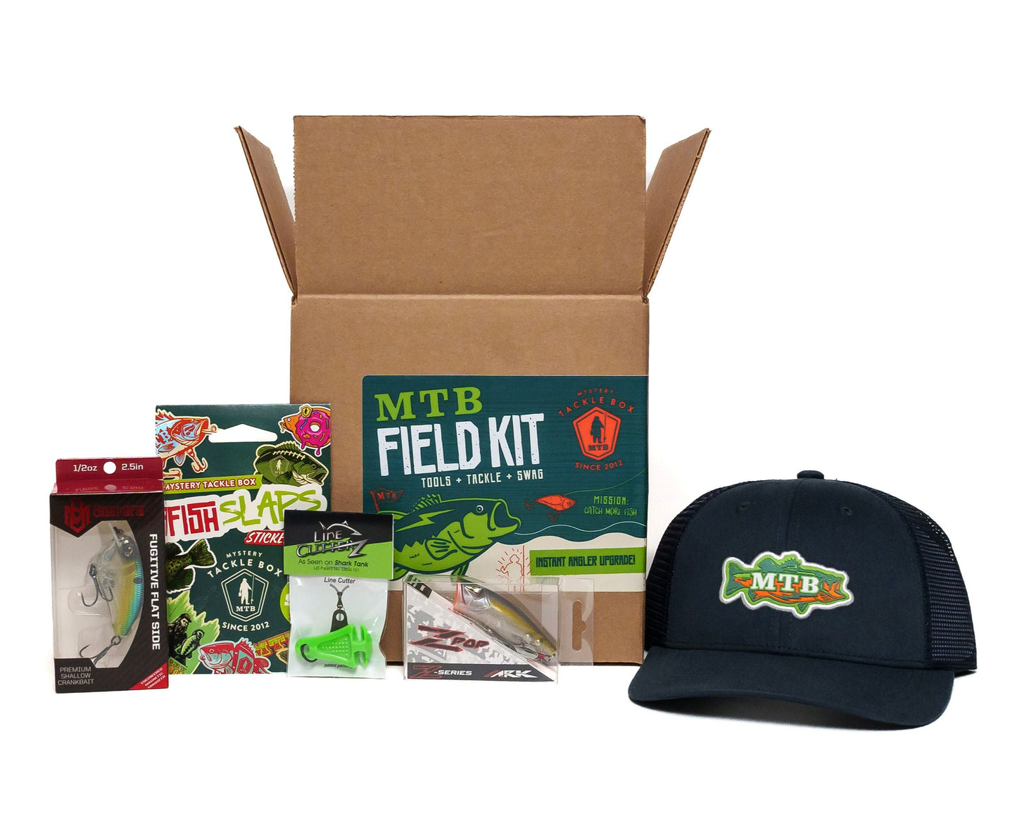 MTB Field Kit with fishing lures and a cap on a white background