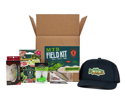MTB Field Kit with fishing lures and a cap on a white background